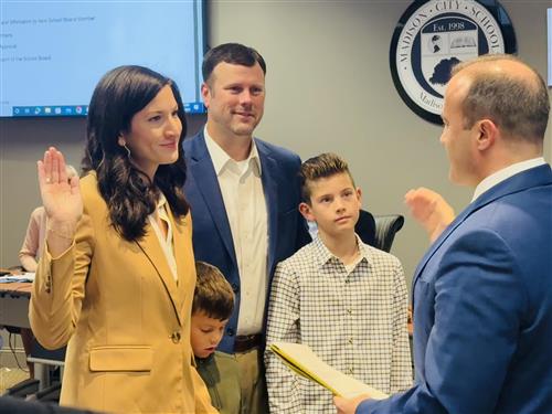 tess halbrooks with family taking the oath
